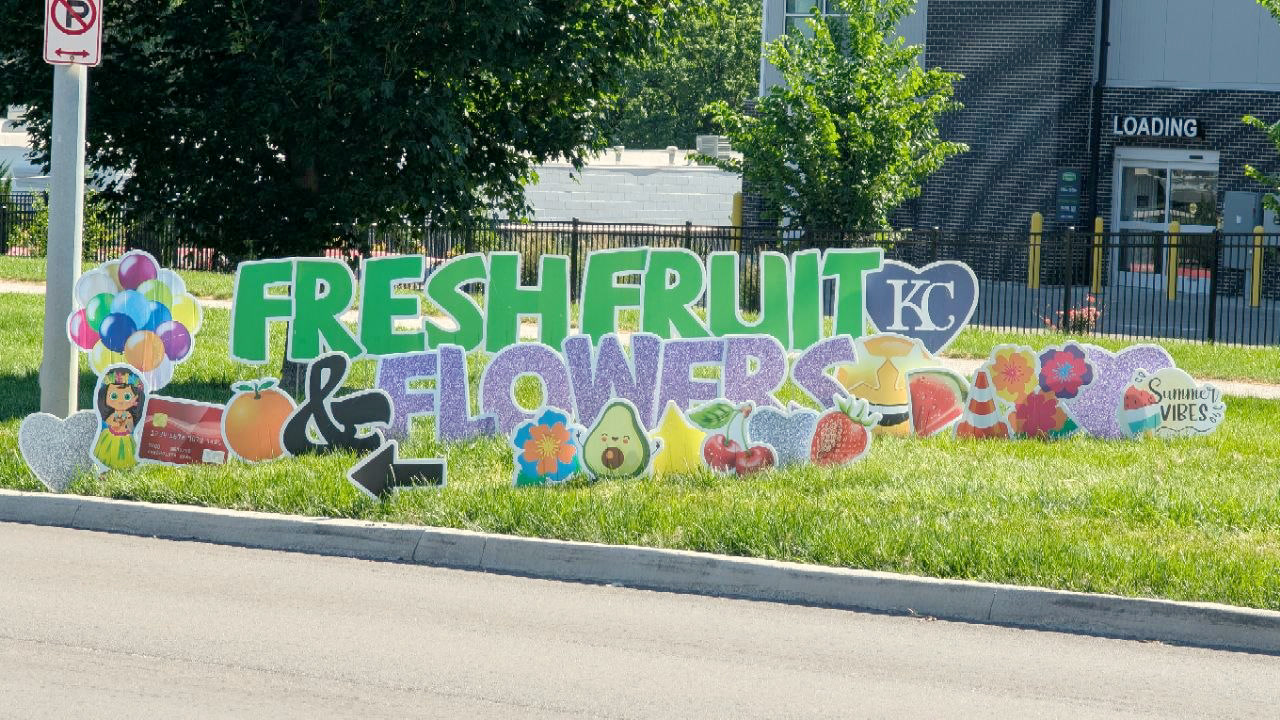Beautiful decorative yard signs spelling Fresh Fruit KC & Flowers by Kelly at Grassroots Greetings.
