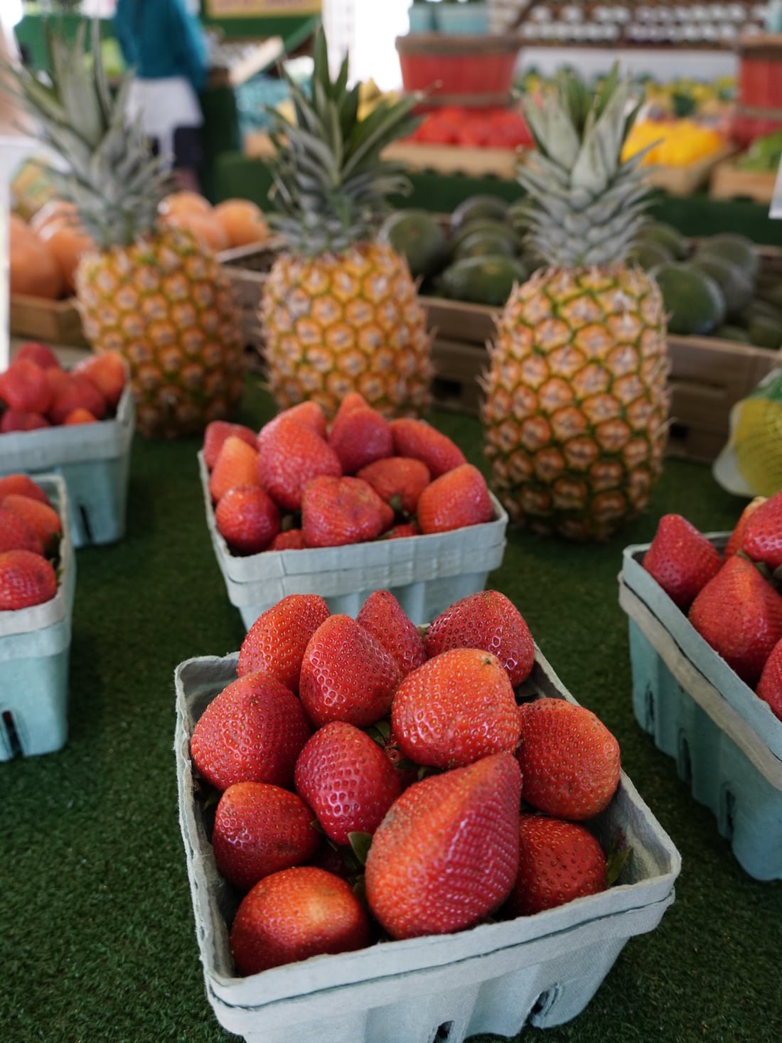 Strawberries and pineapples on display