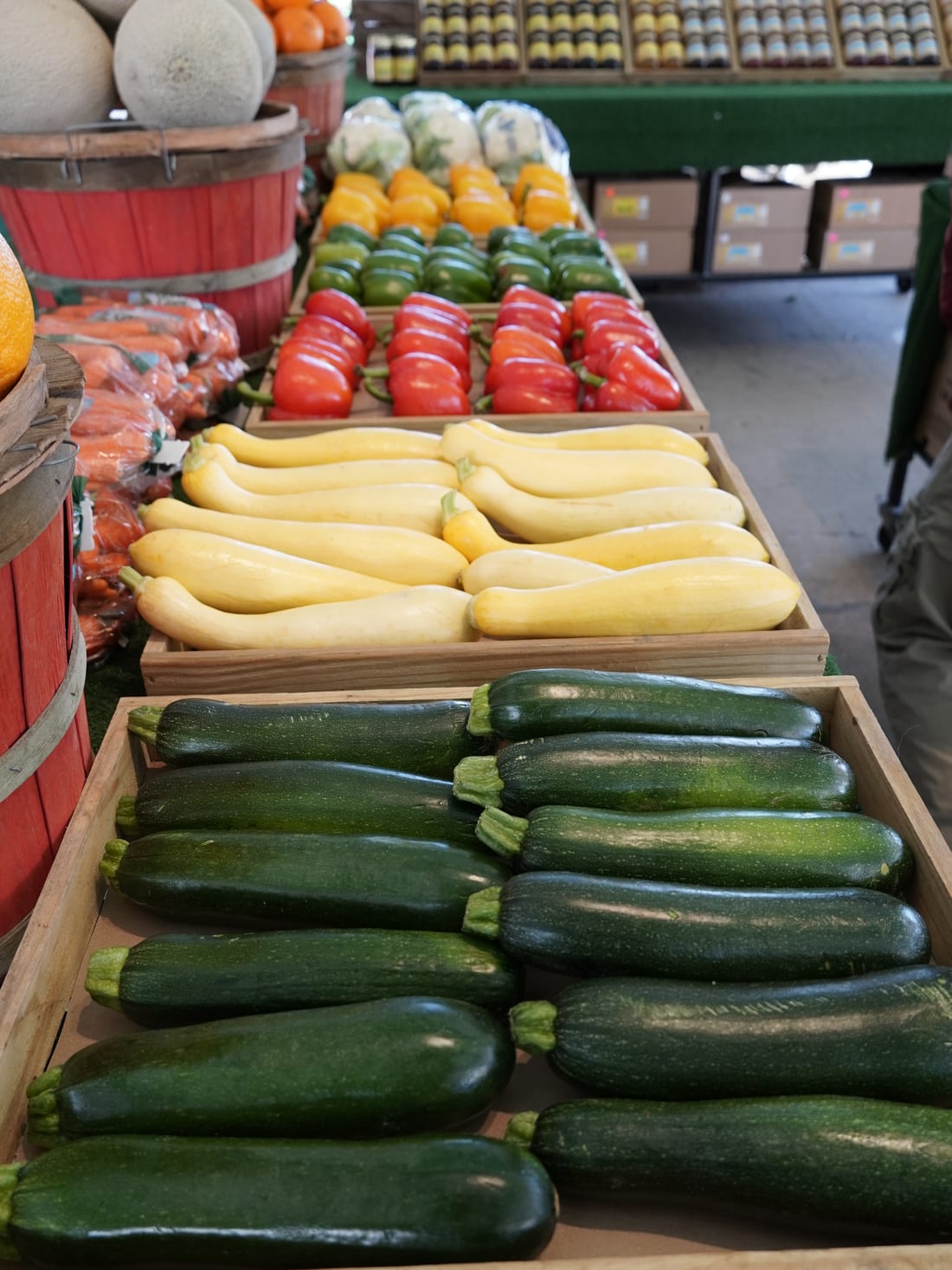 Trays of zucchini, yellow squash, and peppers